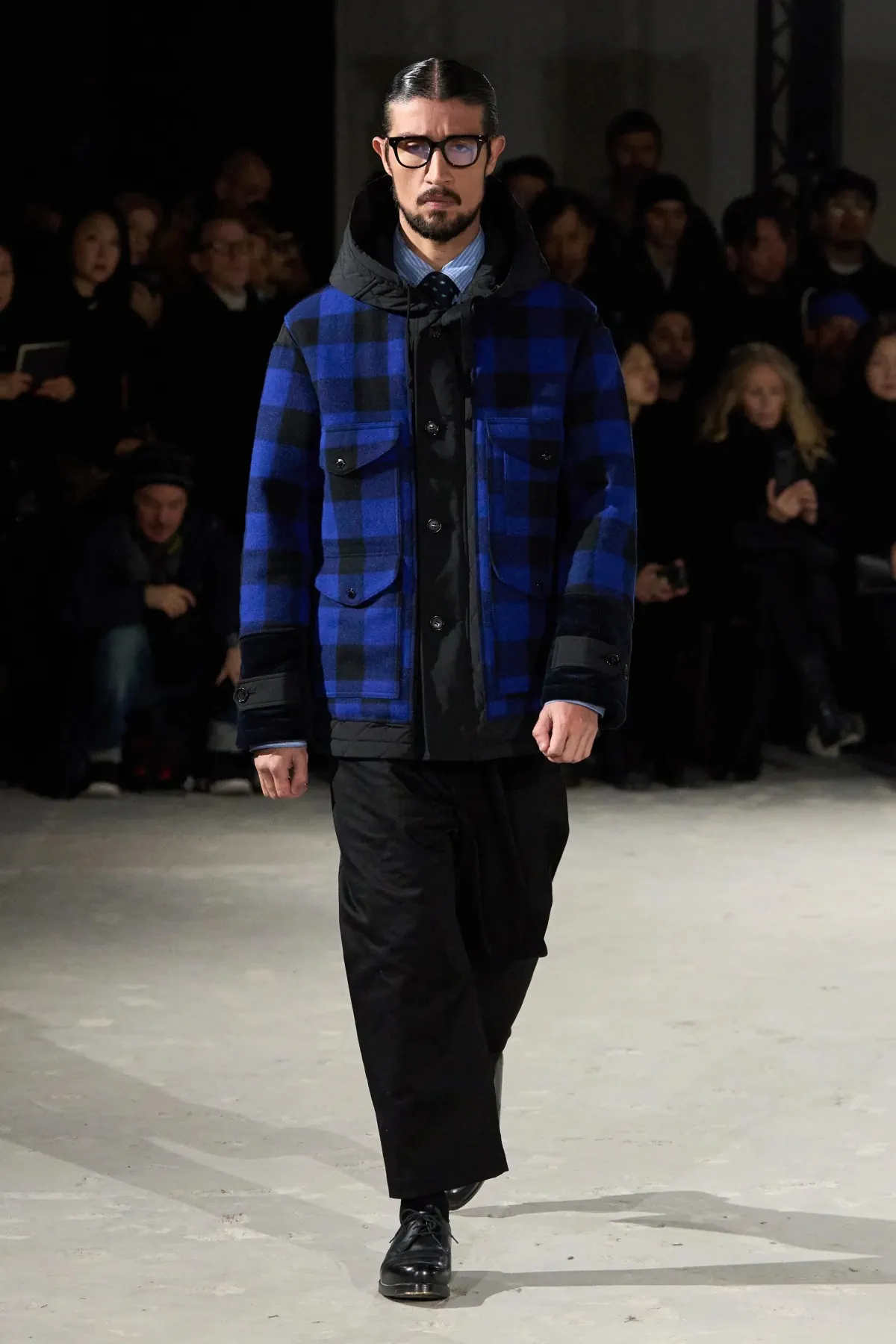 La collection automne 2025 de Junya Watanabe Man associe des vêtements de travail traditionnels à une touche urbaine